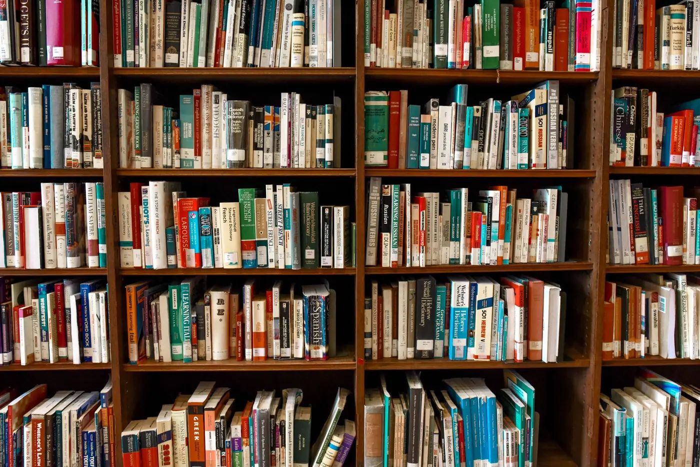 Close view of wooden shelves filled with books